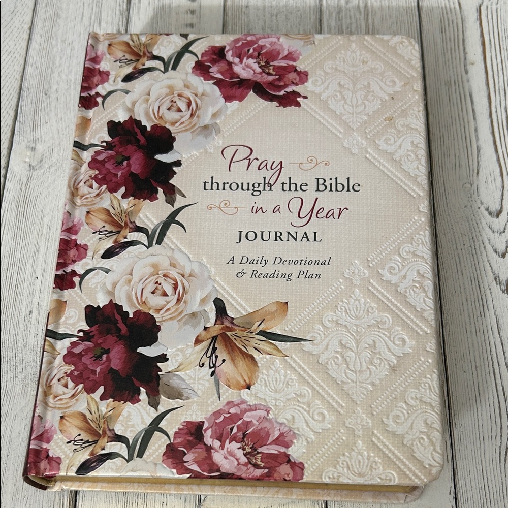 A Daily Devotional & Reading Plan. Pray through the Bible in one year. Journal